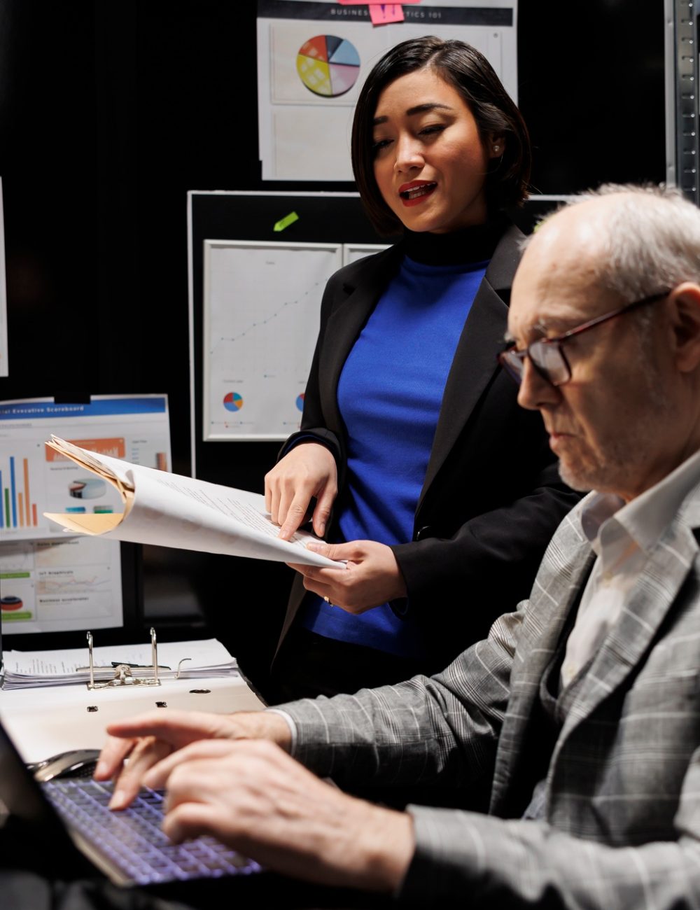 Businessmen checking analytical data