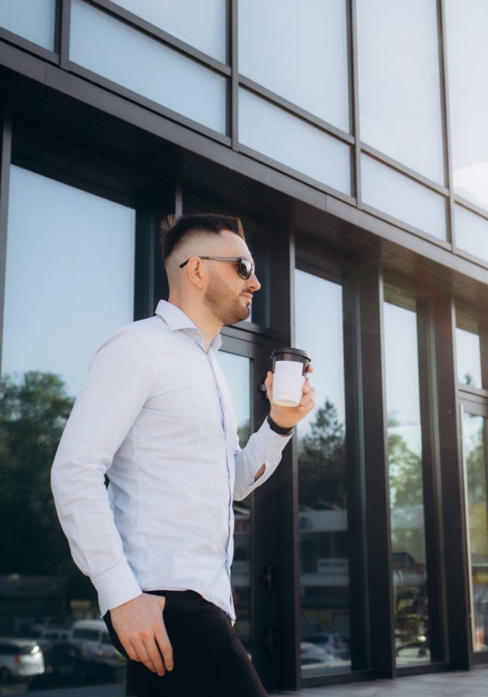 Confident male chief executive of architecture corporation going to meeting with business partners