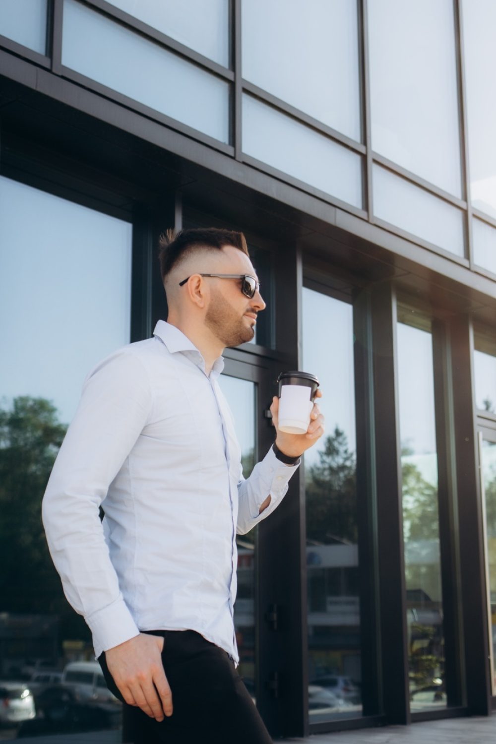 Confident male chief executive of architecture corporation going to meeting with business partners