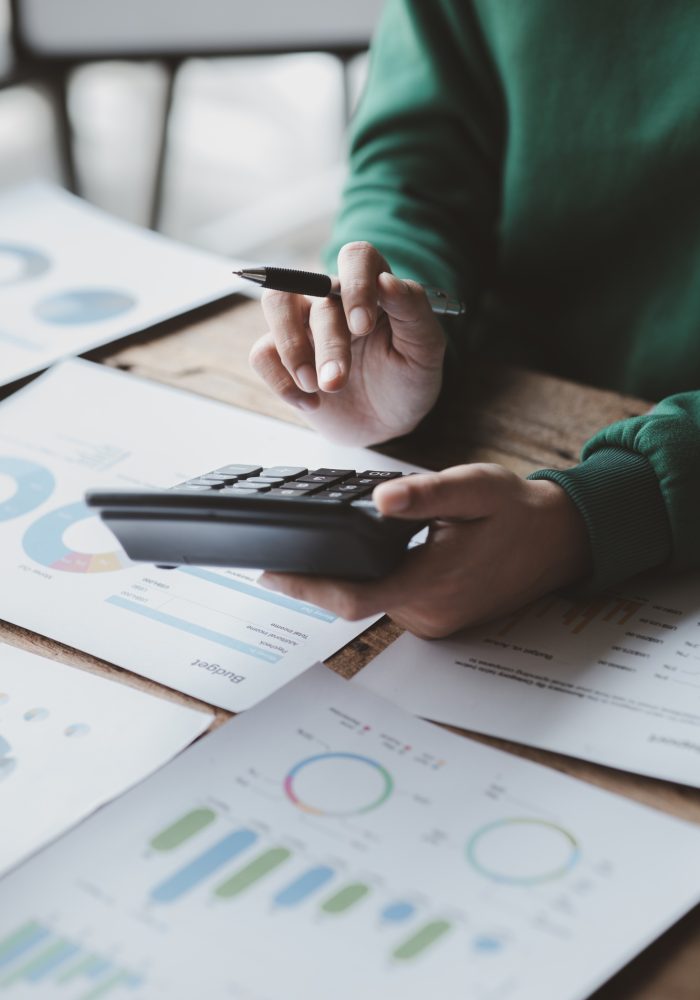 Financial accountants are checking documents from the finance department, verifying company financia