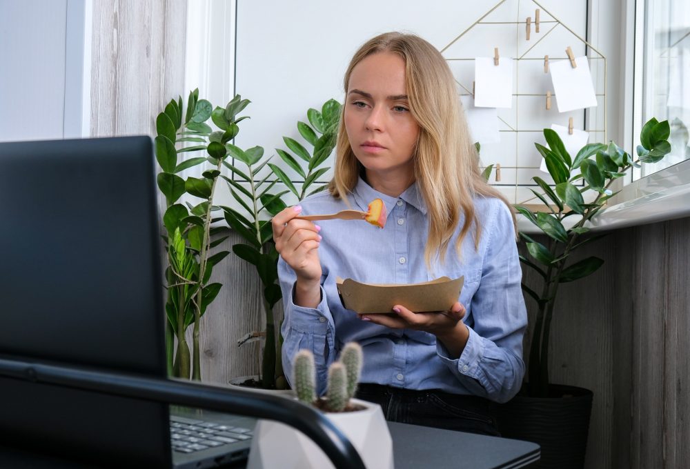 Woman holding lunch zero waste box, food delivery box with healthy meal weight loss diet menu, vegan